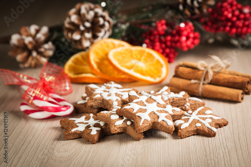 Christmas cookies on a wooden surface with the background decor