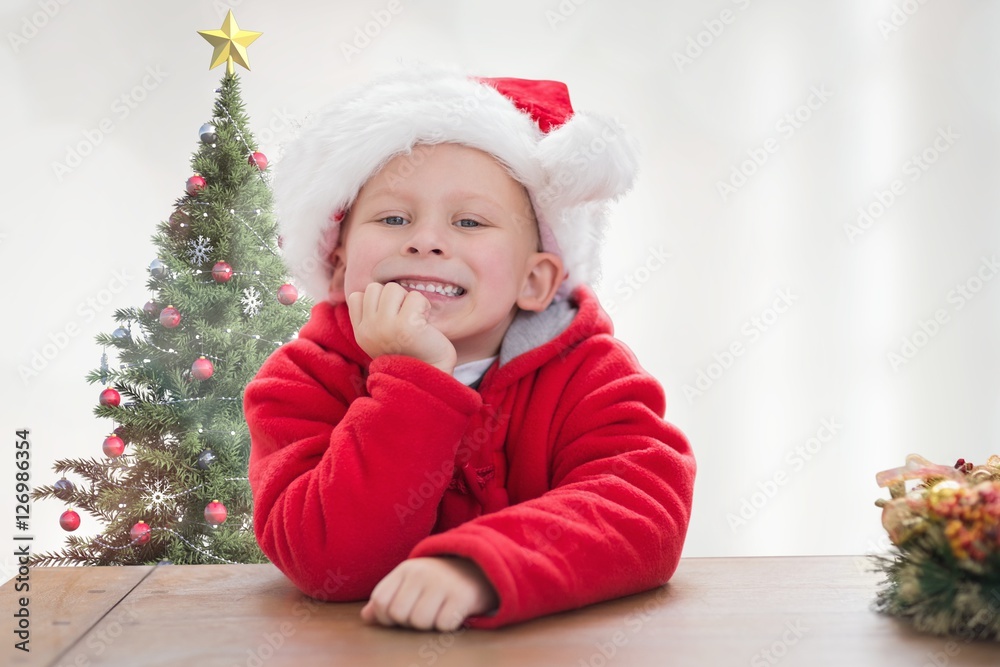 Portrait of smiling boy in santa costume leaning on table Portrait of smiling boy in santa costume leaning on table