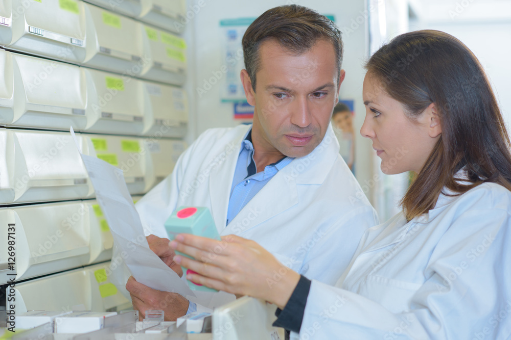 Dispensing pharmacists in discussion Dispensing pharmacists in discussion
