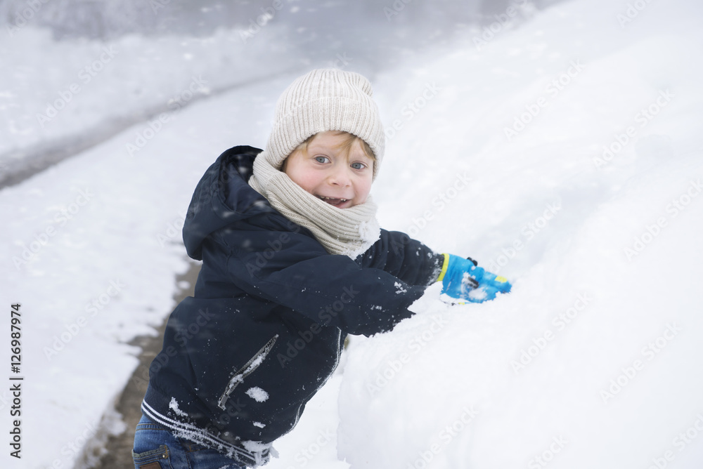 happy boy with the snow in winter happy boy with the snow in winter