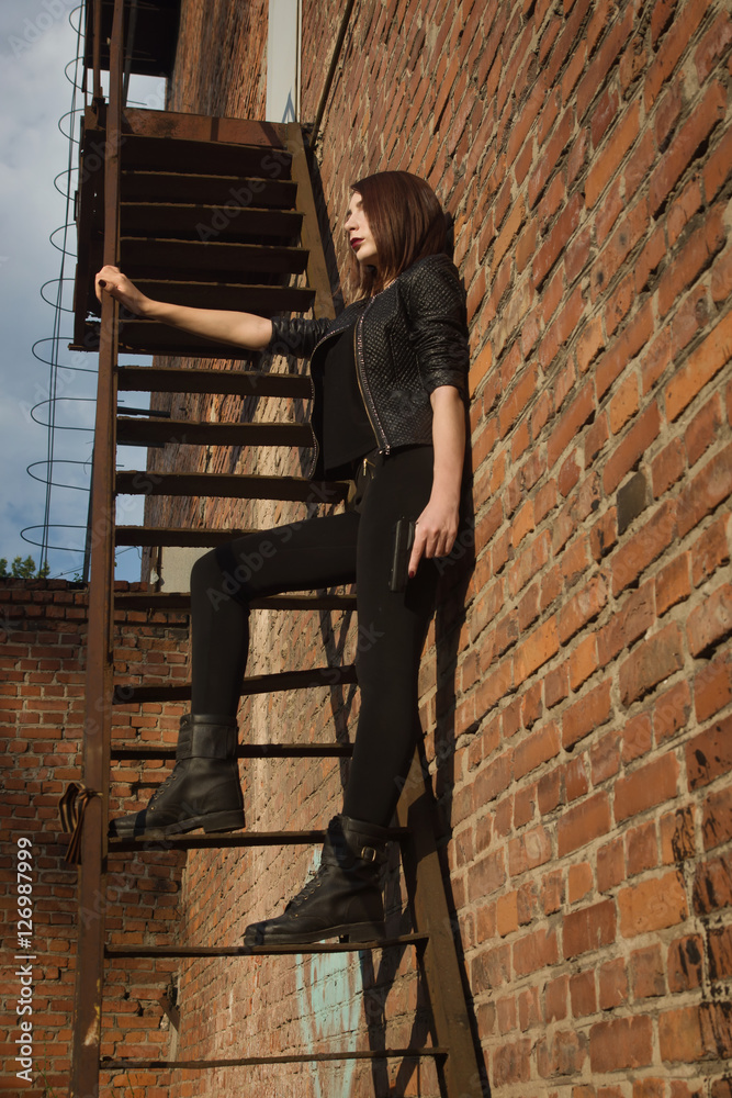 Noir film style woman in a black suit Noir film style woman in a black suit
