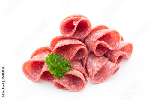 Salami sausage slices isolated on white background.
