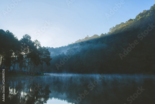 Morning in Pang Ung Lake,North of Thailand, is a tourist place where people come to vacation in the winter. Because of the large reservoir The cold causes steam to rise above the surface.