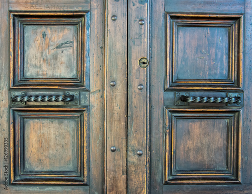 Details of an ancient Italian door in Florence, Italy.