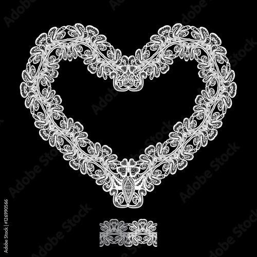White Heart shape is made of lace doily isolated on black backgr