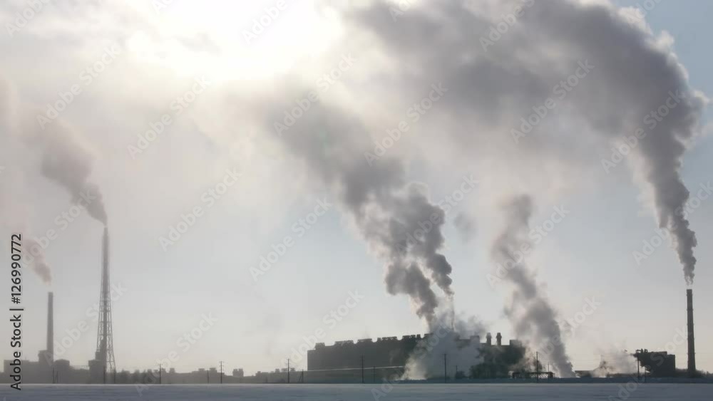 White and black clouds from pipes of industrial factory White and black clouds from pipes of industrial factory