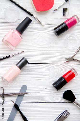 set for manicure and make-up on wooden background