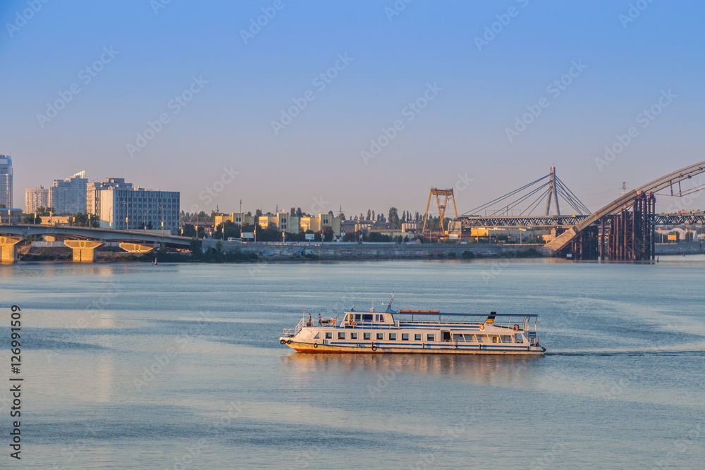 ship floats on the river by city