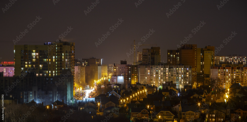 View of night city. Houses, night lights. Background