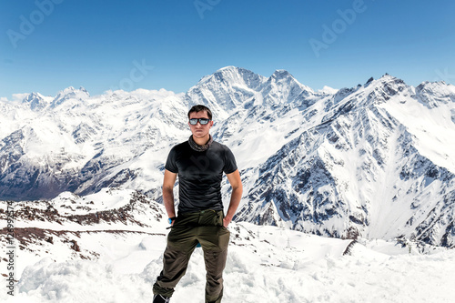 Hiker at the mountains covered with snow