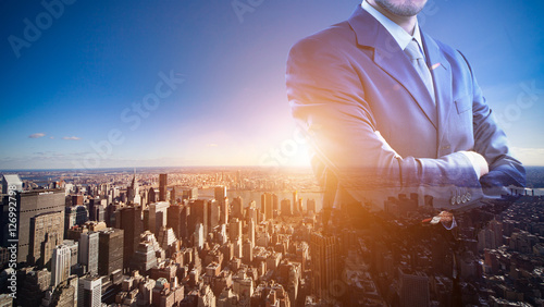 Photography Double exposure of a businessman in front of a big city