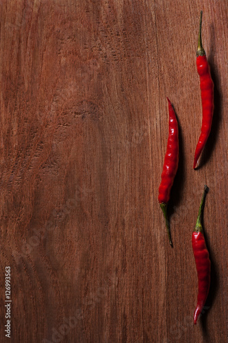 Cayenne pepper on wooden table