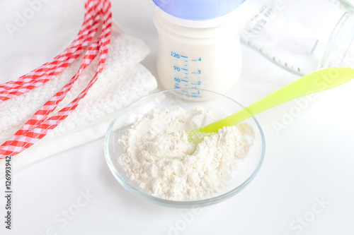 preparation of mixture baby feeding on white background