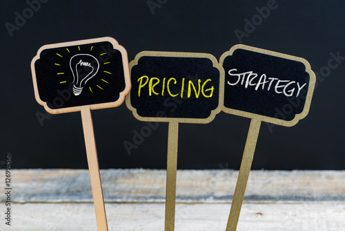 Concept message PRICING STRATEGY and light bulb as symbol for idea