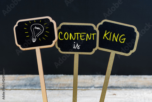 Concept message CONTENT IS KING and light bulb as symbol for idea