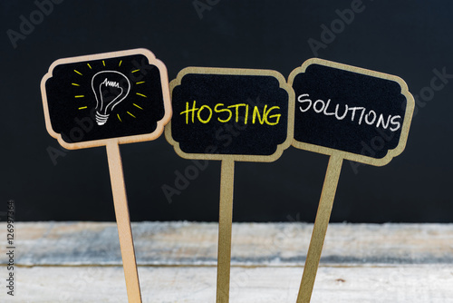 Concept message HOSTING SOLUTIONS and light bulb as symbol for idea