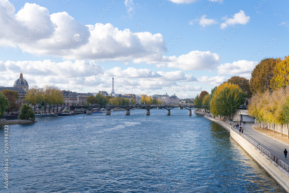 View of Seine river and Eiffel tower from Pont Alexandre III bridge in Paris during sunshine day in autumn