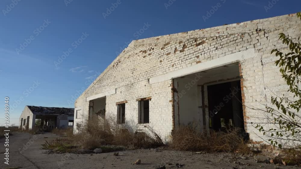 Old ruined farm animals. View from the outside. Dolly shot Old ruined farm animals. View from the outside. Dolly shot