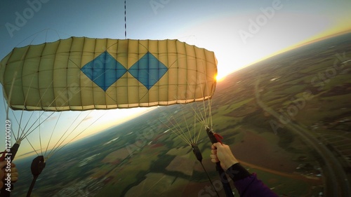 Paragliding at the sunset pov, blurred background