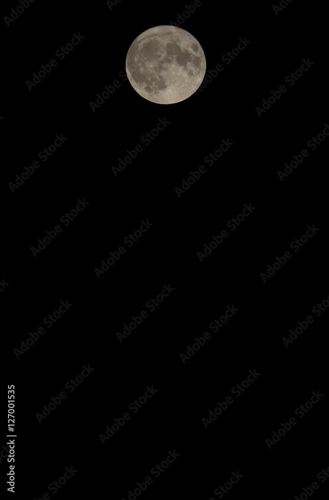 Super moon on a black sky. The moon is composed to the upper part of image. Super moon on a black sky. The moon is composed to the upper part of image.