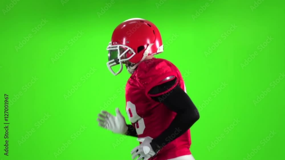 Football player running with the ball. Slow motion. Close up. Green screen Football player running with the ball. Slow motion. Close up. Green screen