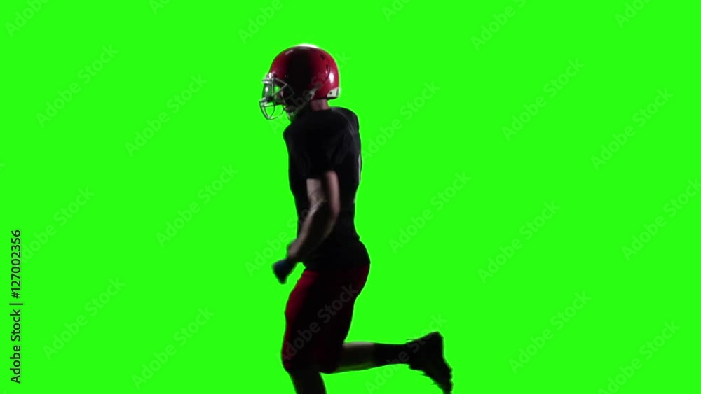 Rugby player running in the red helmet. Green screen. Slow motion Rugby player running in the red helmet. Green screen. Slow motion