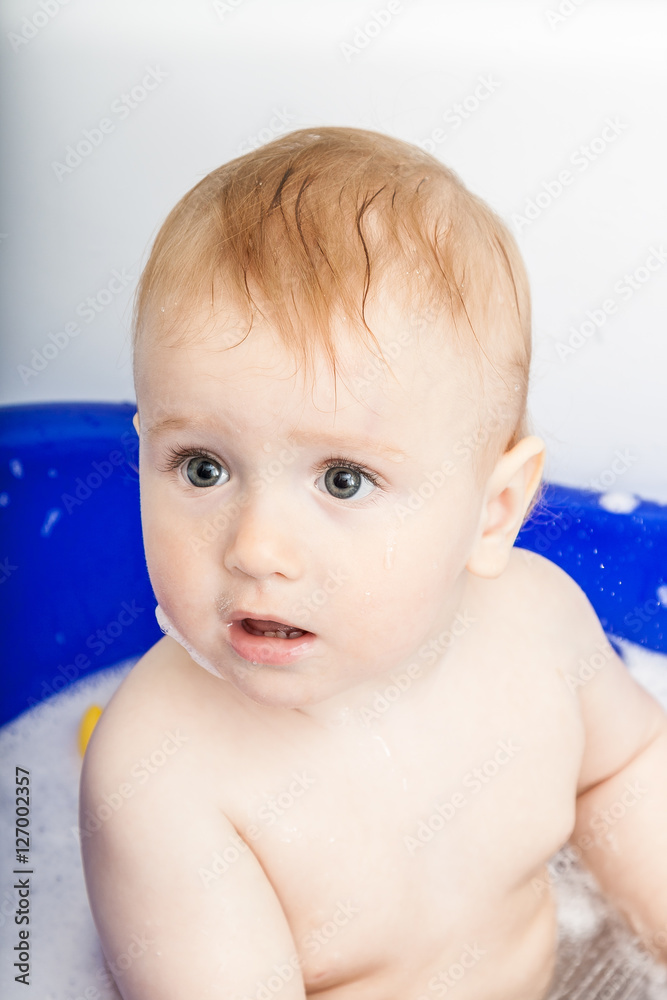 Funny happy baby bathing, swimming and playing with the water Funny happy baby bathing, swimming and playing with the water