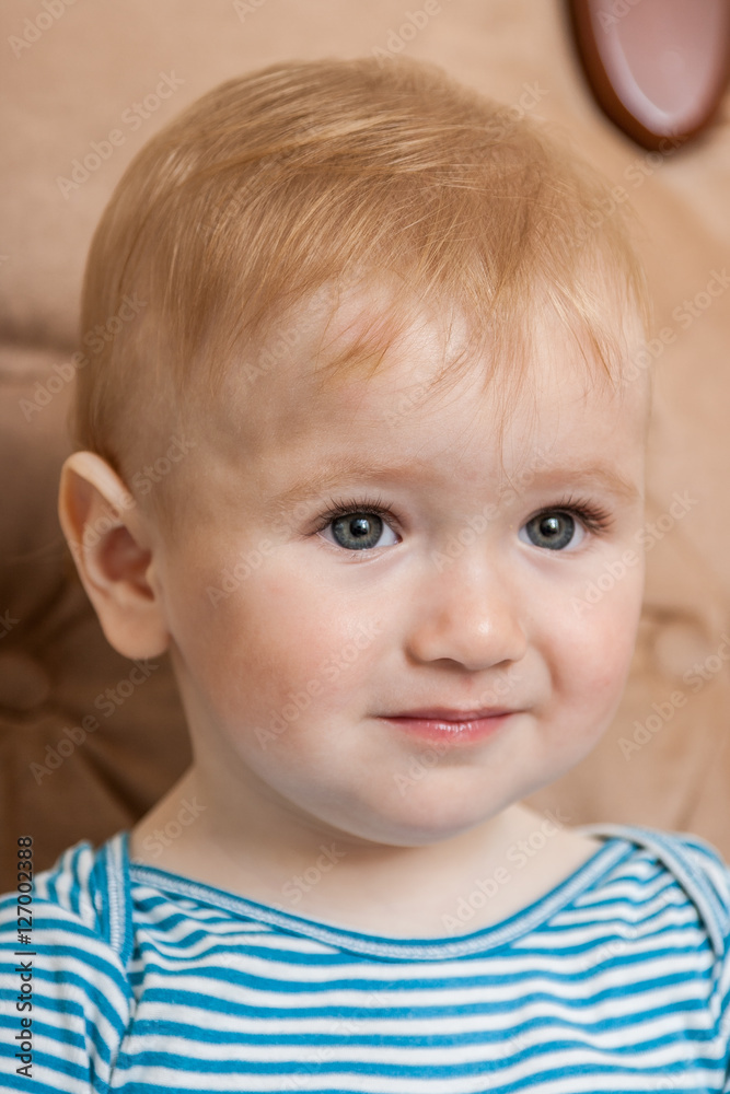 Portrait of a cute, charming kid looking forward