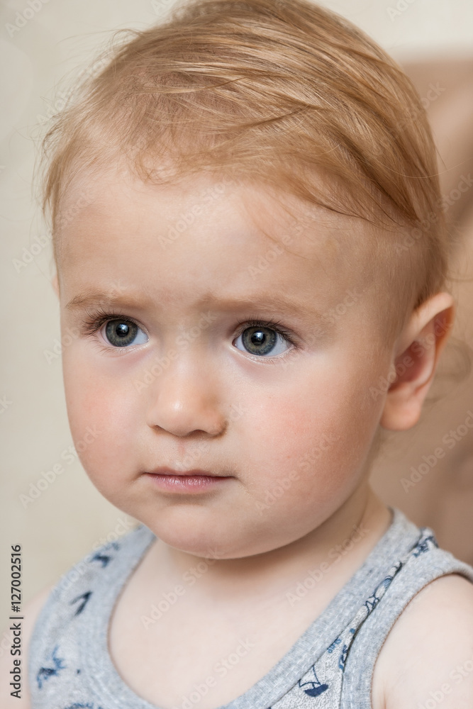 Portrait of a cute, charming kid looking forward Portrait of a cute, charming kid looking forward
