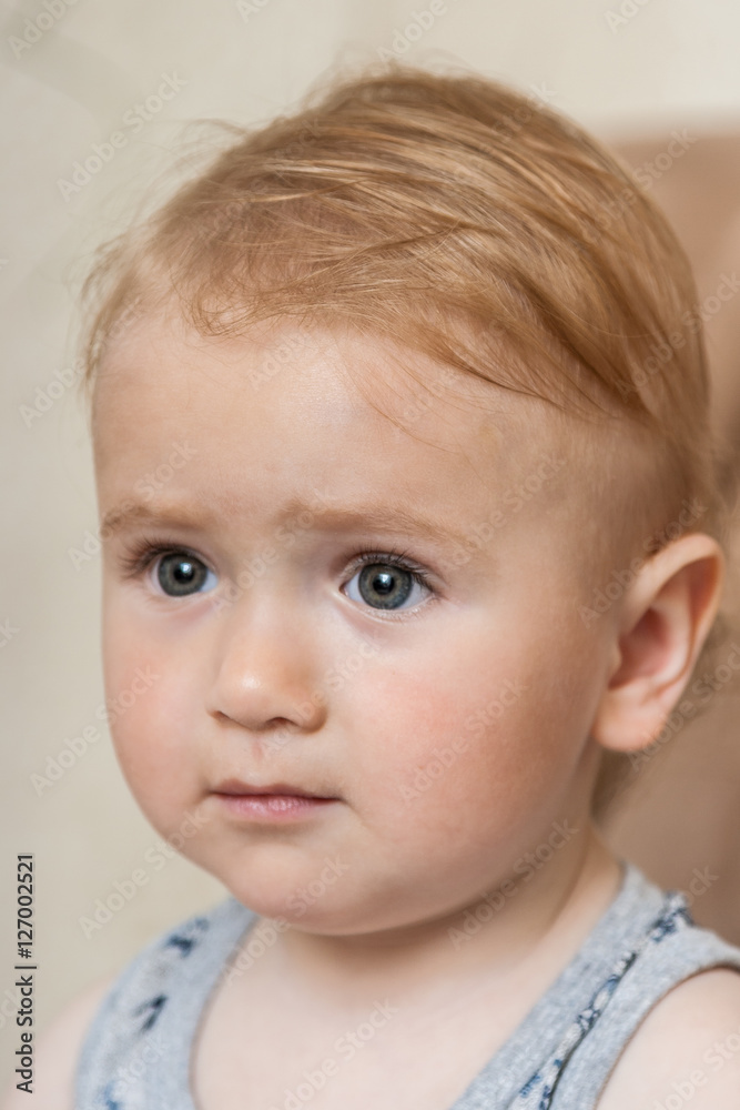 Portrait of a cute, charming kid looking forward