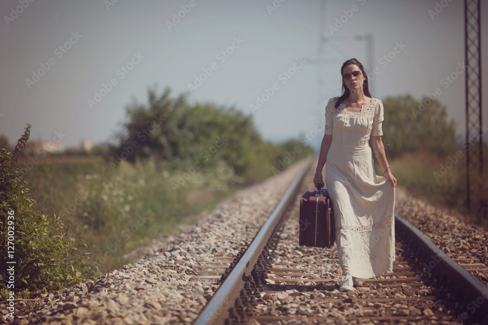 Fototapeta premium Woman on a railway retro style