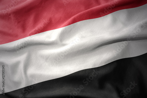 waving colorful flag of yemen.
