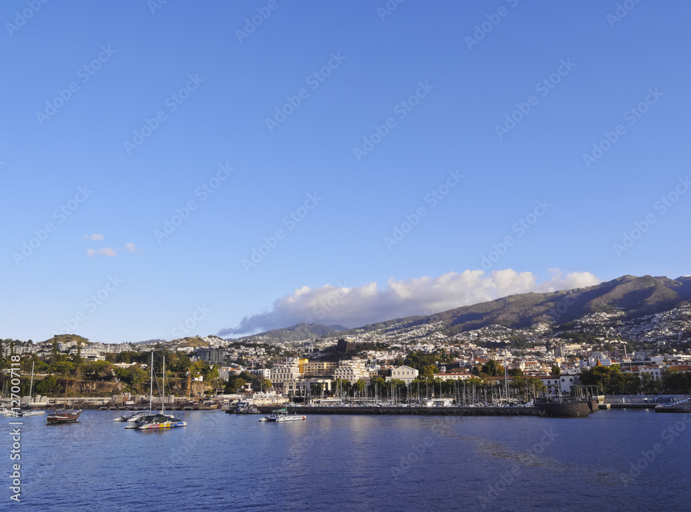 Portugal, Madeira, Funchal, Cityscape viewed from the ferry leaving the port..