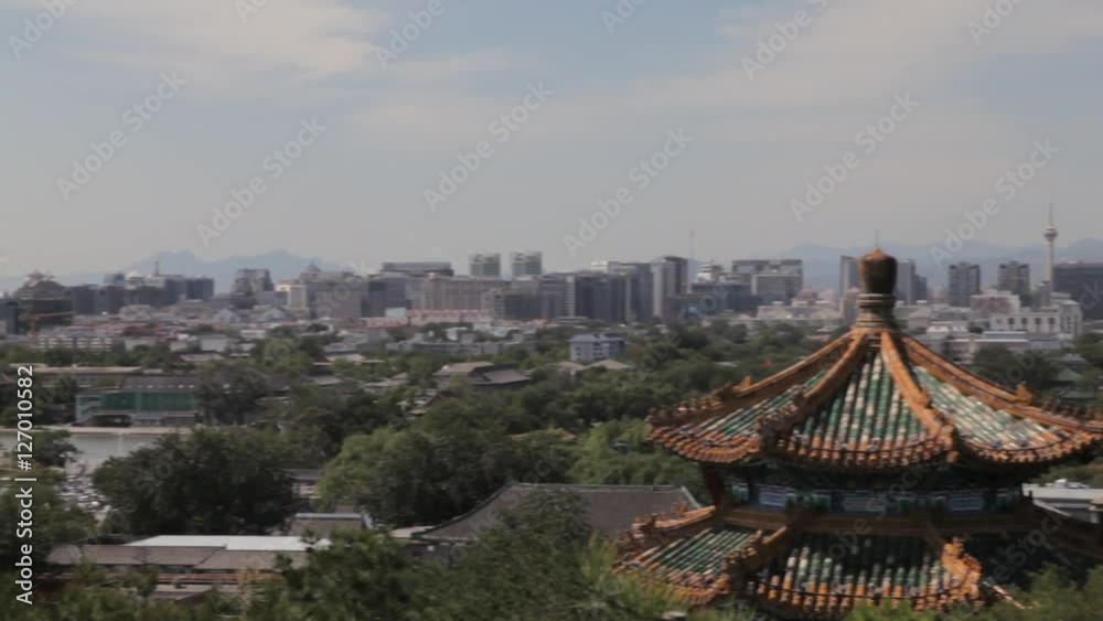 WS PAN Cityscape with old temple rooftop in foreground / Beijing, China WS PAN Cityscape with old temple rooftop in foreground / Beijing, China