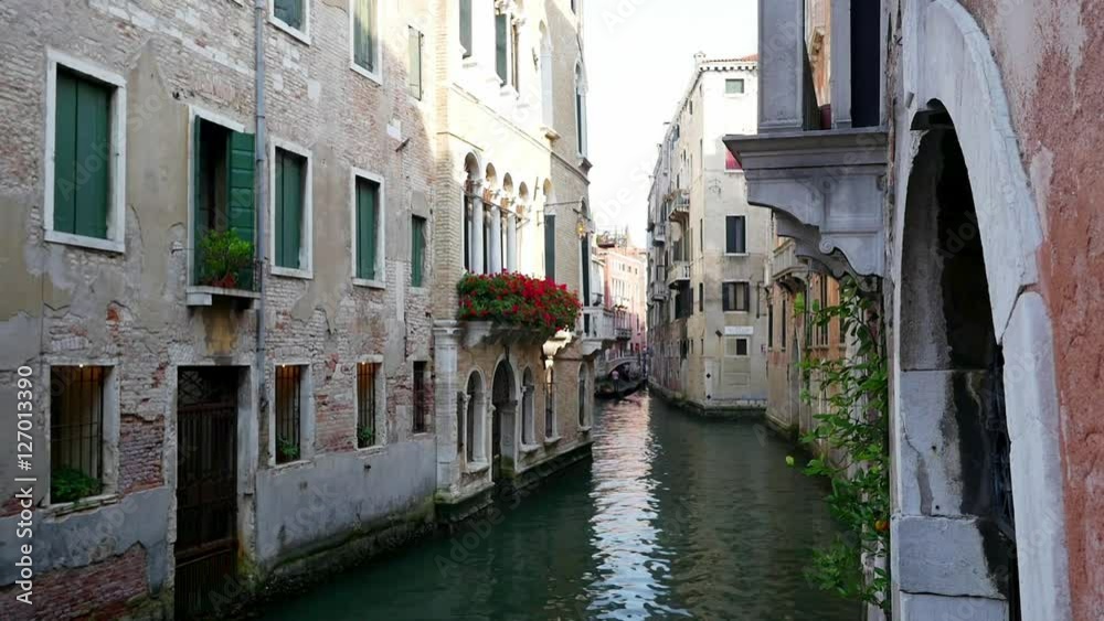 Beautiful narrow venice canal and neighborhood buildings in the water Beautiful narrow venice canal and neighborhood buildings in the water