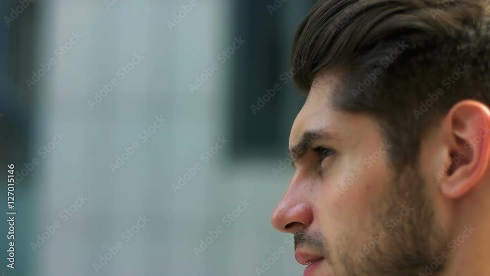 Close up of handsome young business man posing on the street. Close up of handsome young business man posing on the street.