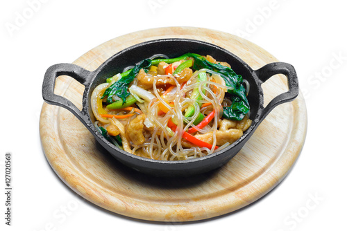 Korean rice noodle with vegetables on frying pan