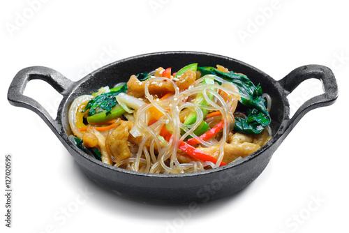 Korean rice noodle with vegetables on frying pan