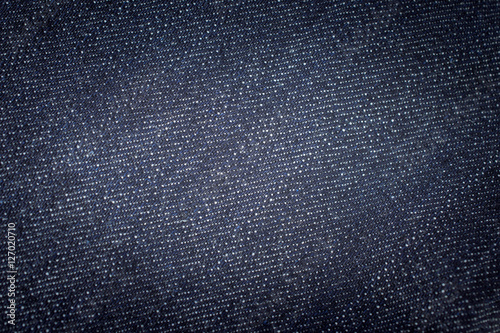 Denim jeans with dark blue shade. jeans background. Detail of de