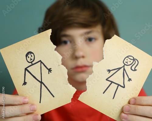 Fotografie sad preteen boy unhappy about parents divorce