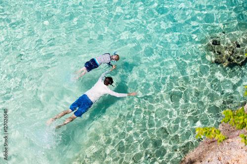 family snorkeling at caribbean