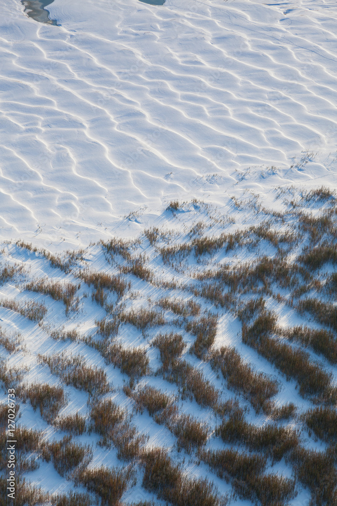 Fototapeta premium Snowdrifts on the river bank