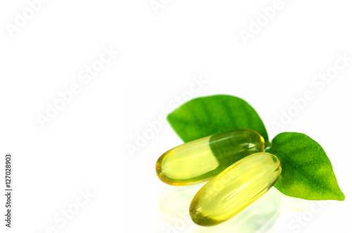 Yellow soft gelatin capsule in natural products concept.