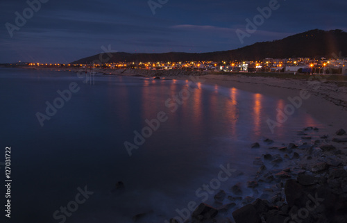 beach with view to he city at dusk