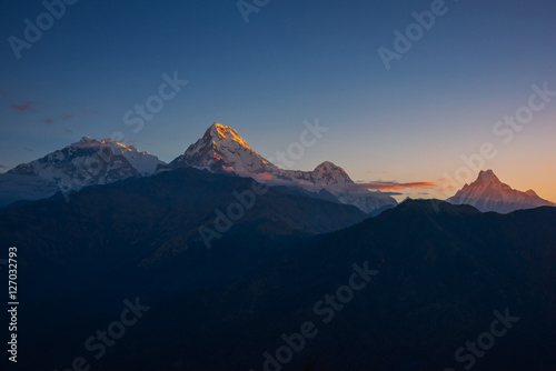 View of Annapurna and Machapuchare peak at Sunrise from Poonhill, Nepal. © devilkae