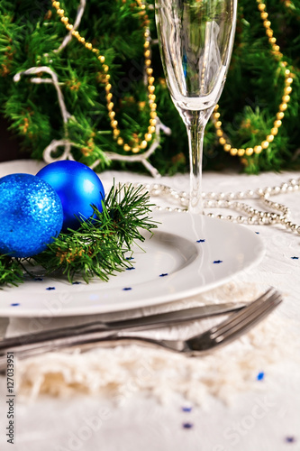 festive table decorated with Christmas balls and beads photo