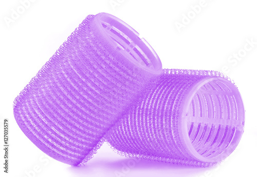 Set of two purple hair curlers isolated on white background