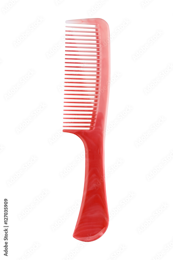 Red plastic comb with handle, isolated on white Red plastic comb with handle, isolated on white