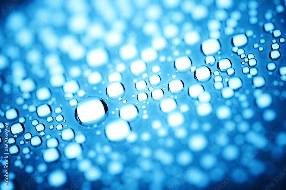 Blue water drops of on treat water-repellent surface in macro lens shot small-DOF for screen wallpapers Blue water drops of on treat water-repellent surface in macro lens shot small-DOF for screen wallpapers