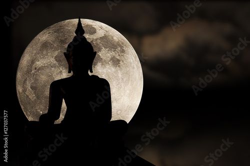 Silhouettes of buddha statue and super moon, Full moon